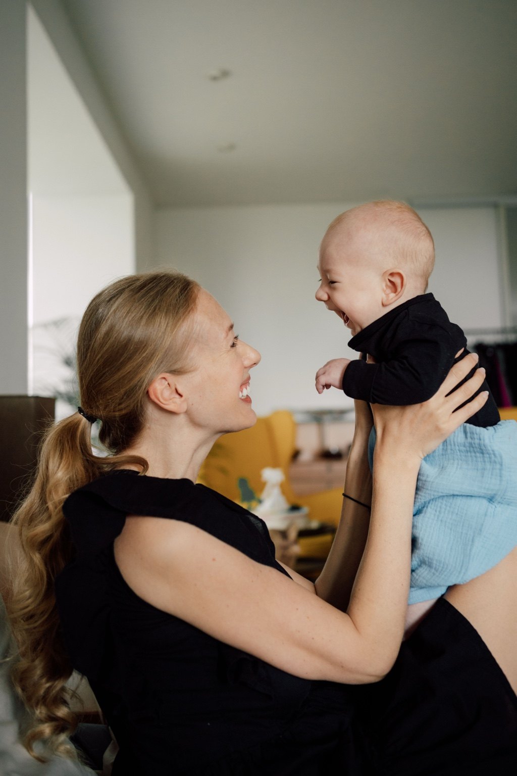 Charlene Rennit holding baby Rumi and smiling