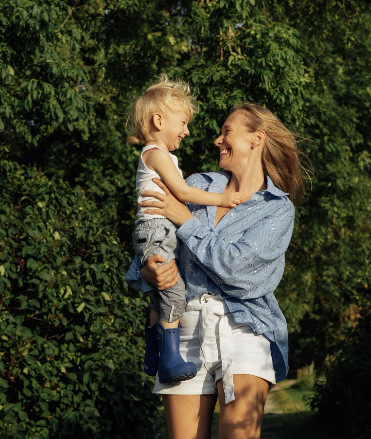 Charlene Rennit smiling with Rumi outdoors