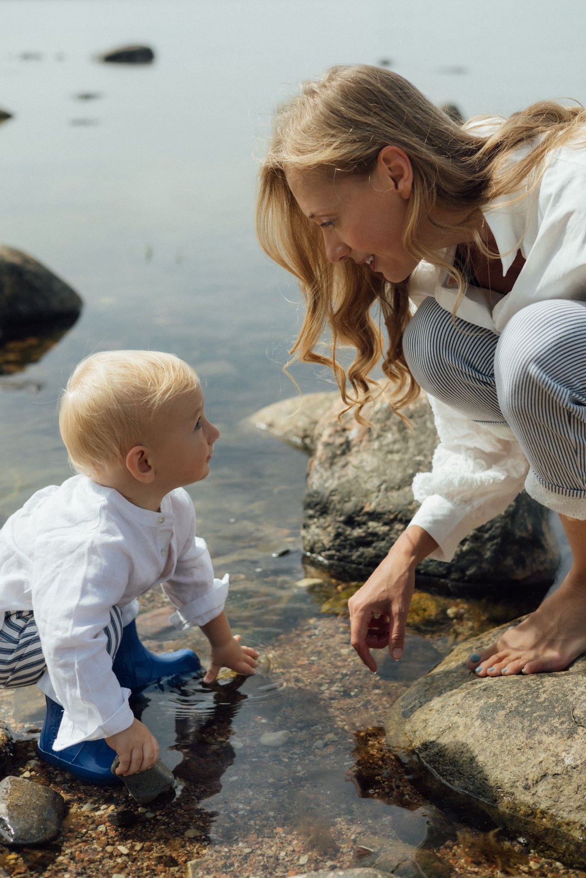 Charlene Rennit and Rumi exploring the shoreline